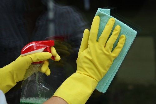 Professional Airbnb cleaner preparing a guest-ready flat in W6