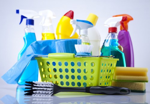 Cleaner wearing PPE while working in a W6 property