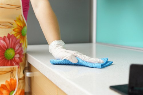 Cleaning technician treating a sofa in a W6 apartment